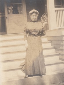 Becky Schweitzer in front of a house