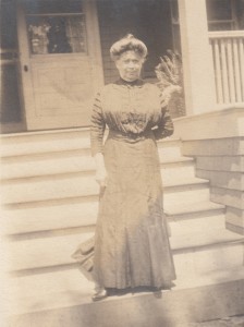 Becky Schweitzer in front of a house